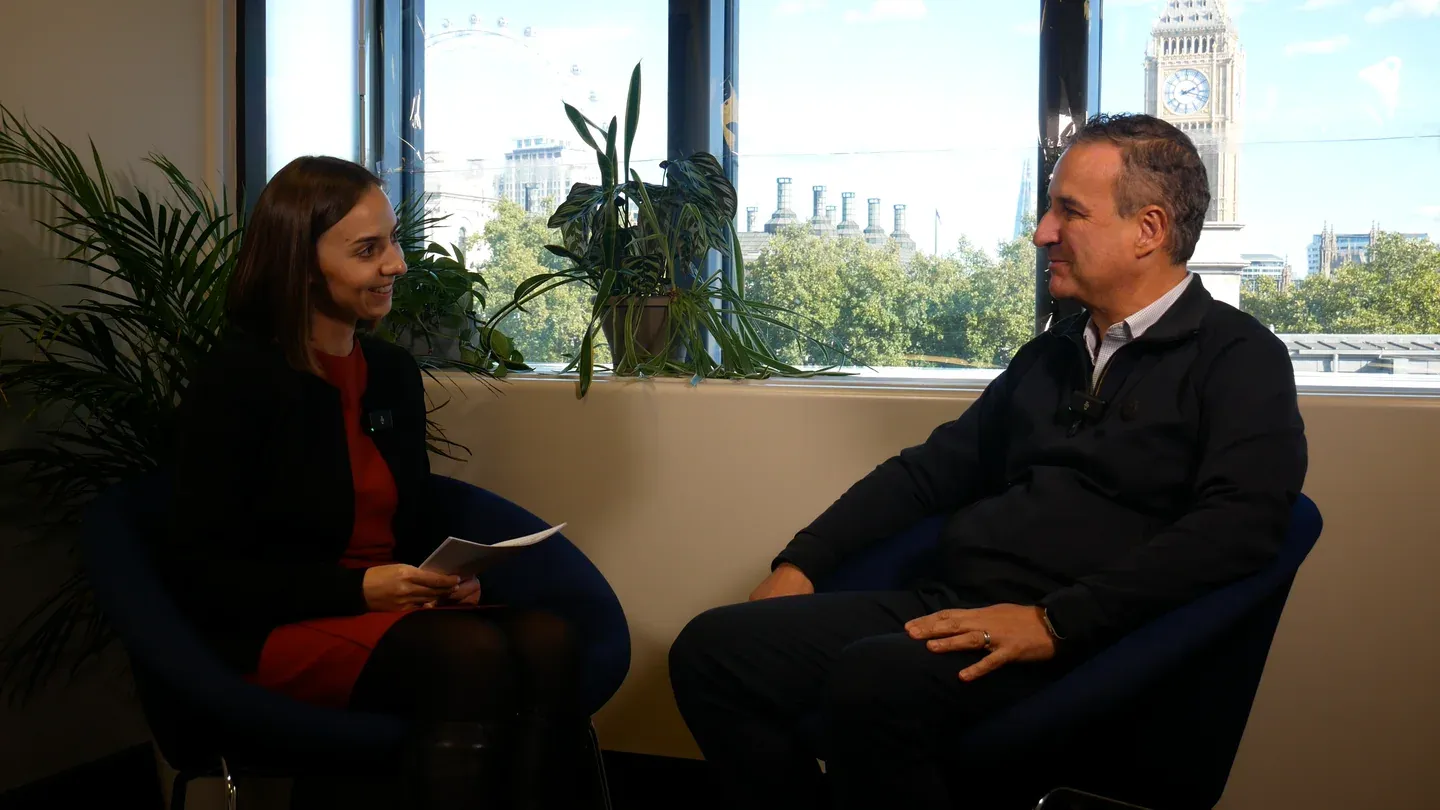 Alberto Guerra in a host-led IPR interview at IAMTN Summit 2026, with Westminster visible behind the speakers.