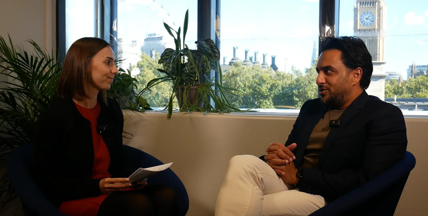 Sayjil Magan in a host-led IPR interview at IAMTN Summit 2026, with Westminster visible behind the speakers.